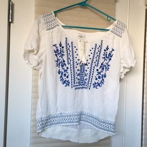 White with a blue design blouse